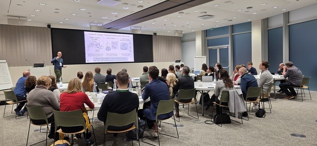 An AI Accelerator workshop in progress, a full room working through a session together