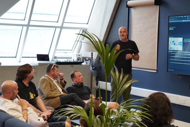 A senior leader opening an AI Accelerator workshop from the front of the room